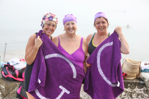 NO REPRO FEE 19/09/2024 Dublin, Ireland. Caroline Murray, Miriam Nolan and Carol Smith join a band of sea swimmers at Seapoint, South Dublin to mark World GO (Gynaecological Oncology) Day,  Friday, 20th September at Seapoint.  The Irish Network of Gynaecological Oncologists (INGO) is encouraging women to ‘Dip or Dance’  this September by either taking the plunge or having a bop as they join patients and advocates around the globe to raise awareness about all five gynaecological cancers (vulval, vaginal, cervical, uterine and ovarian) and their risk factors, and to combat the stigma associated with gynaecological cancer. Photograph: Leon Farrell / Photocall Ireland